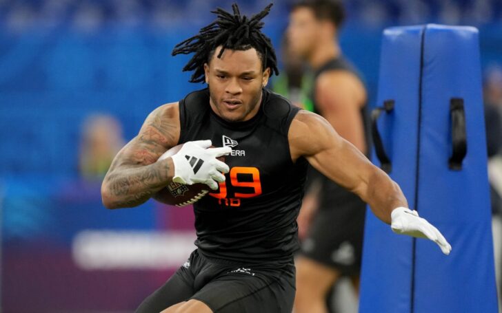 Omarion Hampton runs at the NFL Combine.